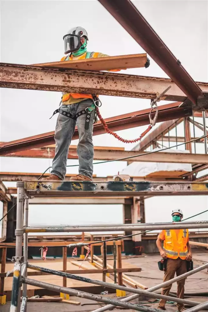 construction workers installing metal beams